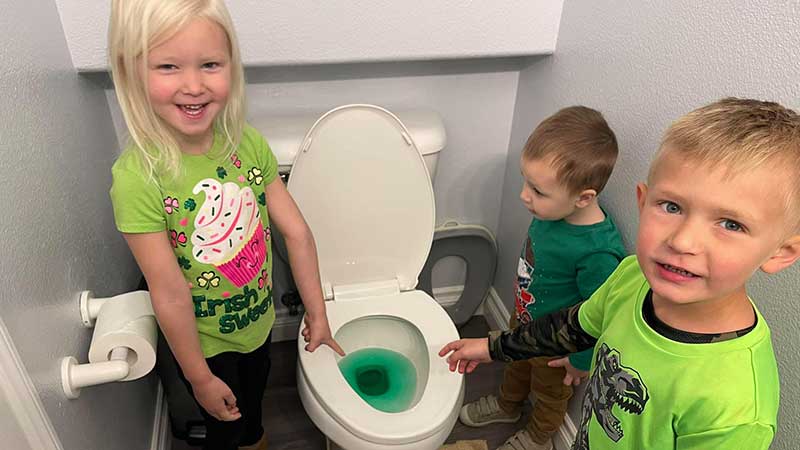 Kids around Green Pee in the Toilet